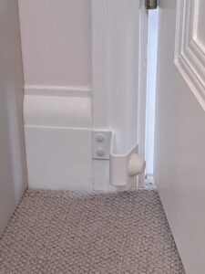 72° Roomstop with white coating installed on doorframe - DoorstopWorld Ltd